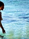Naked teen nudist lets the water kiss her body
